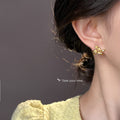 Gold Tone Clear Stone Osmanthus Flower Earrings In Clip And Stud Styles view 4
