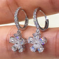 Silver Flower Drop Hoop Earrings In A Polished Decorative Design view 3