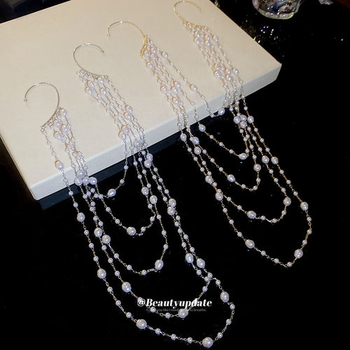Arranged product view of the layered pearl and chain ear hook  in two tones earrings shown in image 2