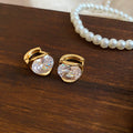 Round Crystal Huggie Earrings in Silver and Gold Tone view 7