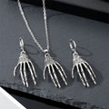 Silver Tone Skeleton Hand Pendant Necklace and Huggie Earrings view 1