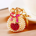 Pearl Heart Fortune Pouch Keychains in Eight Pictured Enamel Colors view 1