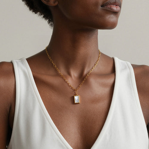 Neckline view of white seashell rectangle pendant necklaces in main image 2.