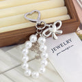 Pearl Beaded Bag Charm With Heart Shaped Clasp And Bow view 2
