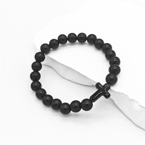 Black bead stretch bracelet with black cross on white cloth