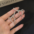 Silver Ribbon Bow Crystal Look Extra Long Stud Earrings view 6