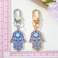 Gold and Silver Tone Blue White Hamsa Eye Clip Keychains view 4