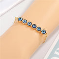 Gold Tone Multi Link Evil Eye Chain Bracelet with Six Round Charms view 3