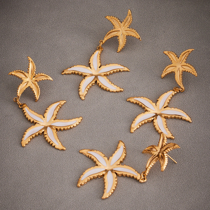 Gold Dual Starfish Drop Earrings with White Enamel Inlay