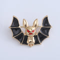 Black Wing Bat Brooch with Gold Tone Body and Red Eyes view 6