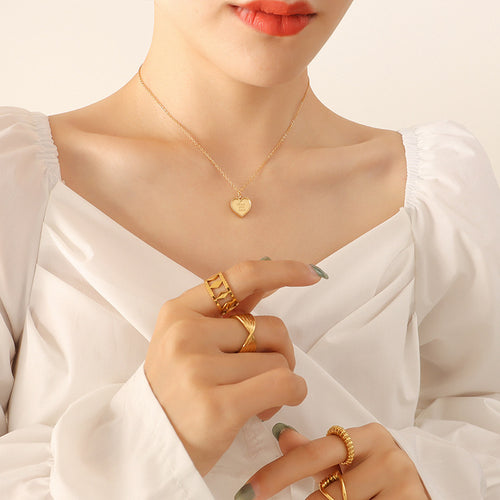 Gold Love you more heart pendant necklace worn with white blouse