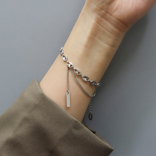 Steel pig-nose double chain bracelet with bar pendant on wrist