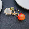 Iridescent 3D Apple Keychains in 6 Glossy Fruit Colors view 4