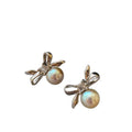 Bow and Pearl Stud Earrings in Gold and Dark Silver view 5
