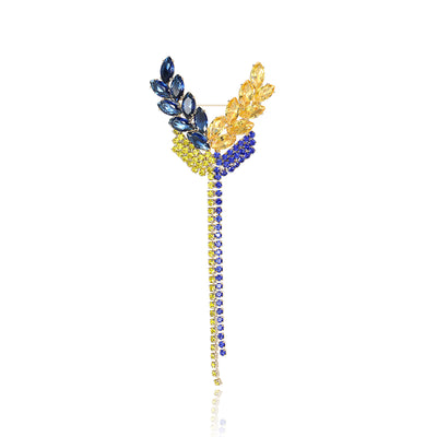 Front view of a long gold-tone wheat stem with blue and yellow grain clusters