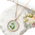 Gold Tone Round Pressed Flower Pendant Necklaces in Fourteen Designs view 5