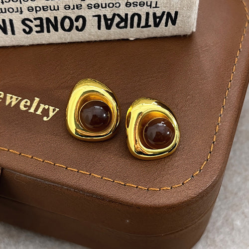Main image showing brown cabochon stud earrings