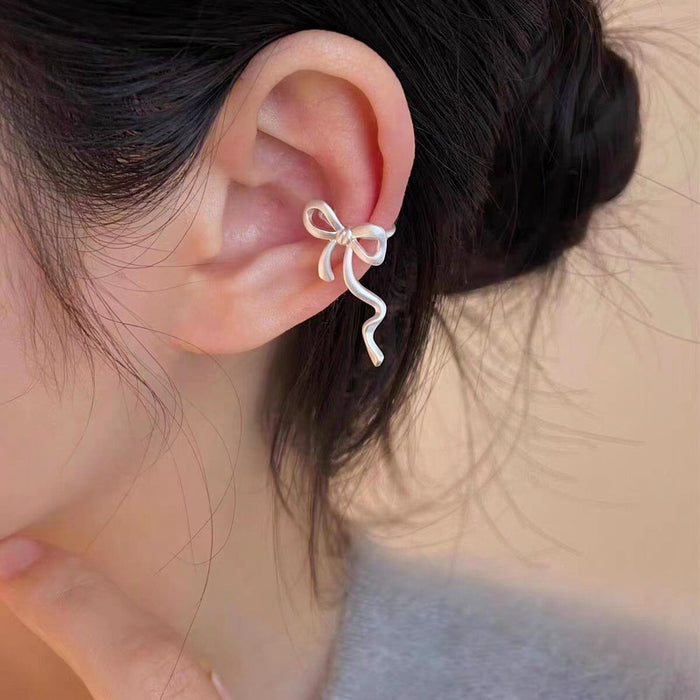 Wavy Bow Clip On Earrings in Silver and Gold Tone With Decorative Details