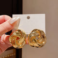 Metal Knot Flower Stud Earrings in Gold and Silver view 4