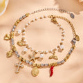 Ocean Charm and Cross Charm Bracelets in Two Metal Tones view 4