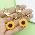 Bee and Honeycomb Charm Keychains Featuring Yellow Sunflower Across 25 Pictured Variations view 1