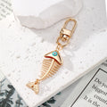 Gold Tone Fish Skeleton Evil Eye Clip Keychains in Five Colors view 3
