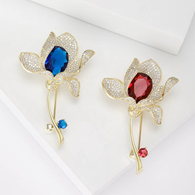 Grouped view of long Stem Crystal Lily Flower Brooch in Blue or Red arranged together.