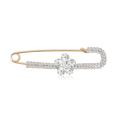 Front view of an elongated safety pin lined with crystals and a small flower