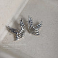 Silver Hollow Butterfly Wing Stud Earrings Abstract Pair view 1