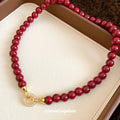 Glossy Red Beaded Necklace with Gold Tone Clasp Fashion Jewelry view 4