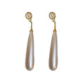 Long White Teardrop Pearl Earrings With Polished Metal Tone Details view 5