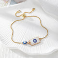 Gold Tone Blue Evil Eye Double-Dangle Slider Bracelets in Eight Designs view 4