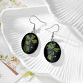 Black Oval Pressed Flower Drop Earrings in Nine Botanical Designs view 11