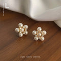 Gold Tone Pearl Flower Stud Earrings Clear Crystal Accents view 1