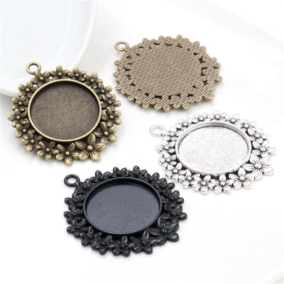Floral Round Cabochon Pendant Bases in Three Metal Finishes shown in a grouped front view
