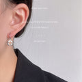 Silver Asymmetric Cross Charm Huggie Hoop Earrings Pair view 3