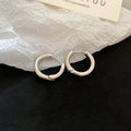 Polished Round Huggie Earrings in Silver Tone and Gold Tone view 6