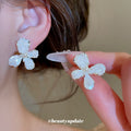 White Floral Shell Look Stud Earrings in Two Sizes view 4