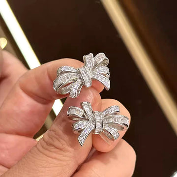 Silver Tone Bow Stud Earrings with Clear Baguette CZ