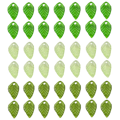 Green leaf charms arranged on a light background