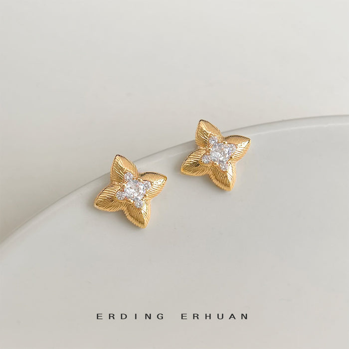Gold Tone Textured Four Point Star Crystal Stud Earrings