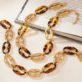 Gold Leopard Resin Link Necklace Bracelet And Drop Earrings view 3