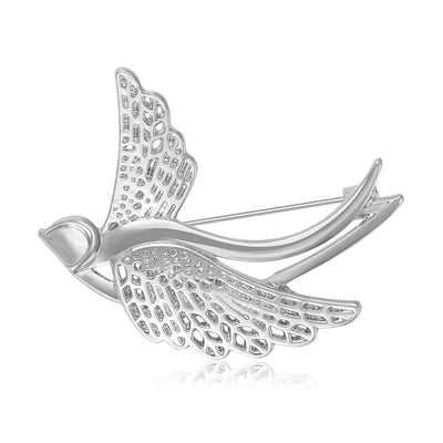 Silver openwork flying swallow bird brooch front view on white