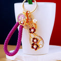 Floral Pipa Keychains With Enamel Bodies and Braided Wrist Straps view 3