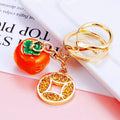 Coin and Persimmon Charm Keychains with Braided Wrist Loops view 6