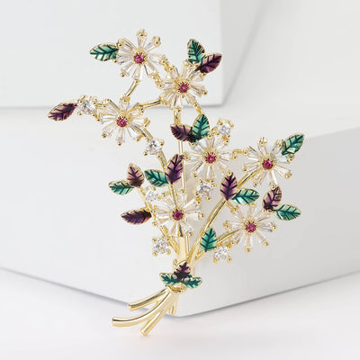 Front view of daisy bouquet brooch with multicolor enamel leaves
