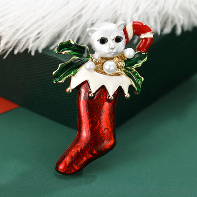 Main front view of White Cat In Red Christmas Stocking Brooch With Green Leaves