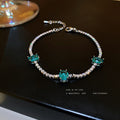 Silver Tone Tennis Bracelet With Three Aqua Oval Stones view 2