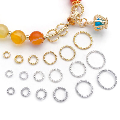 Gold-tone assorted shape beads arranged on a light background