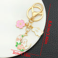 Thirteen Pink Rabbit Blossom Wreath Metal Keychain Designs view 7